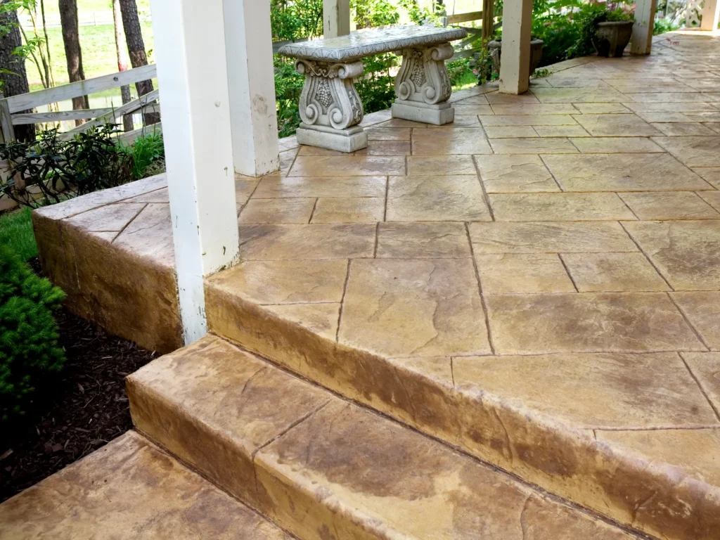 stamped concrete breezeway offers a place to relax
