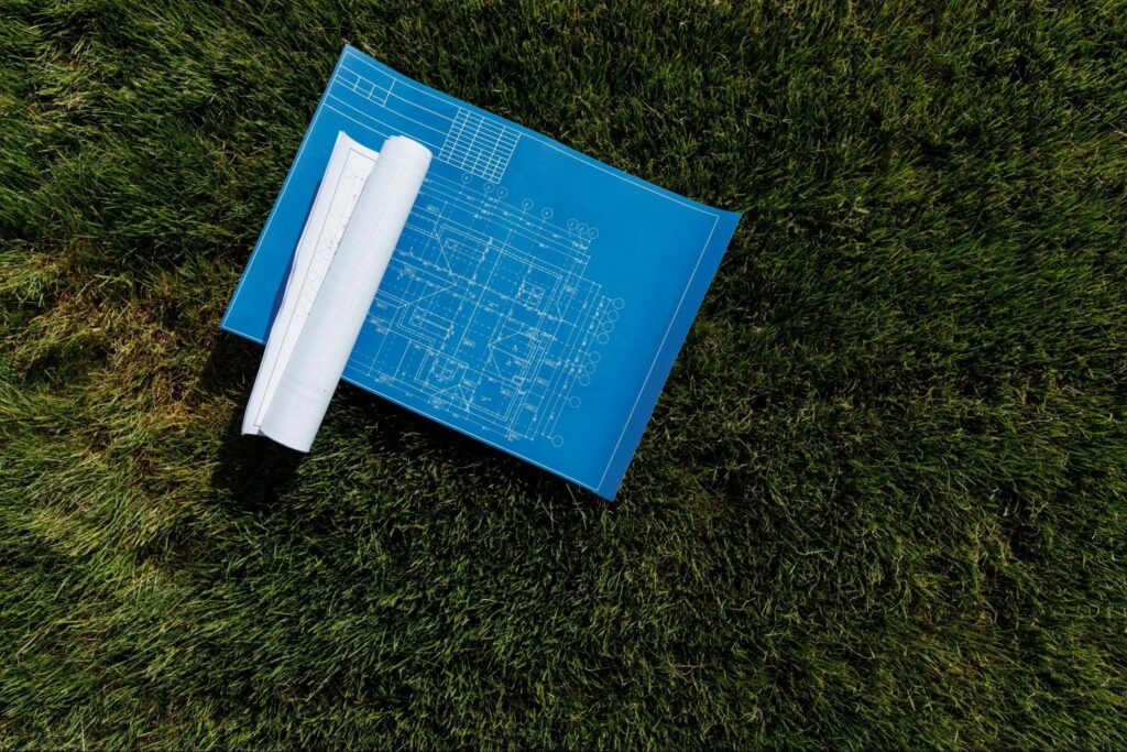 Design plans on grass reflecting the landscape design planning process used by JRD Landscape Design.
